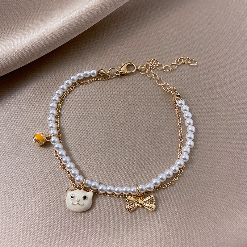 Venta al por mayor Pearl Love Heart Dreamcatcher Pulsera de aleación